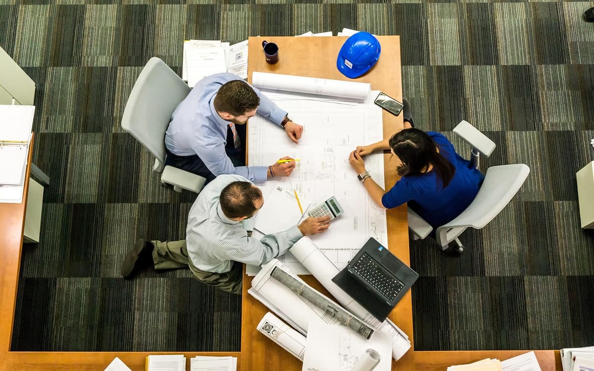 Overhead view of a team planning together at a table